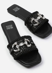 SARAH JEWEL DETAIL FLAT SANDALS IN BLACK RAFFIA