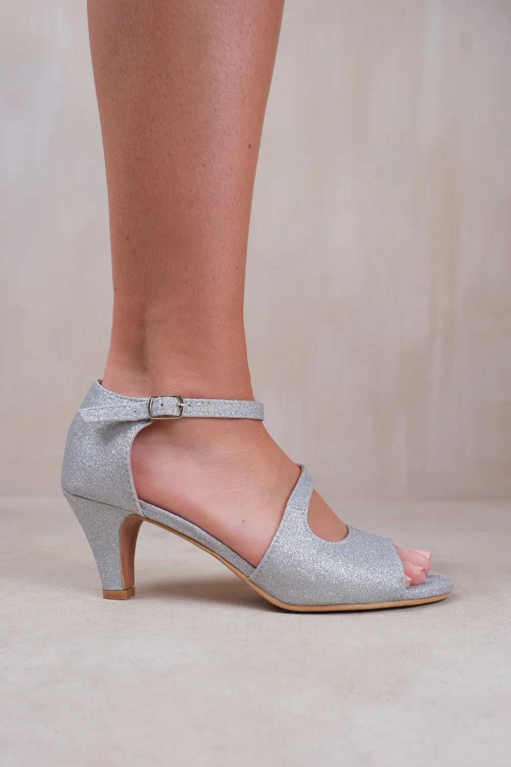 BEATRICE WIDE FIT LOW KITTEN HEEL WITH CROSSOVER STRAP IN SILVER GLITTER