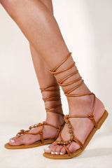 ASPYN TOE THONG SANDALS WITH BEADS AND LACE UP DETAIL IN TAN FAUX LEATHER