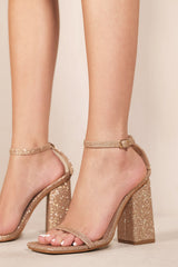 FALLON SQUARE TOE HIGH BLOCK HEEL SANDALS WITH ANKLE STRAP IN GOLD SPARKLY SHIMMER