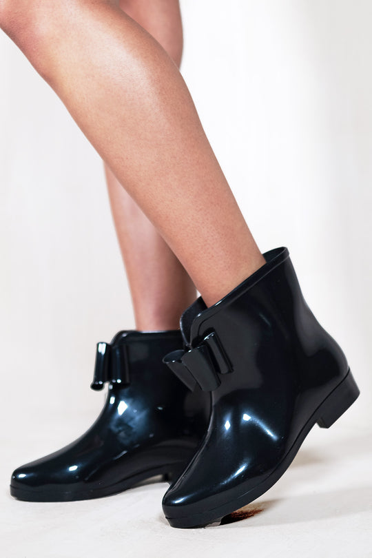 TRISH  LOW HEEL ANKLE WELLIES WITH BLACK BOW IN BLACK PATENT FAUX LEATHER