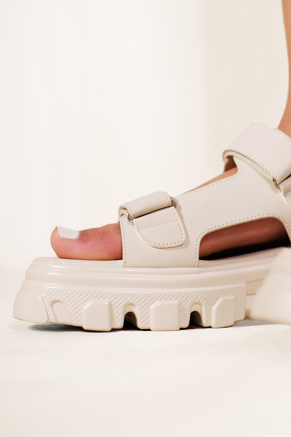 CHUNKY CLEATED SOLE SANDALS WITH FASTENING STRAPS IN IVORY CREAM FAUX LEATHER