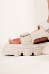 CHUNKY CLEATED SOLE SANDALS WITH FASTENING STRAPS IN IVORY CREAM FAUX LEATHER