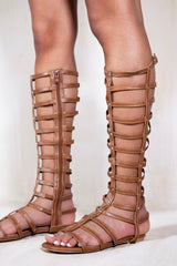 LEIA GLADIATOR KNEE HIGH FLAT SANDALS IN TAN FAUX LEATHER