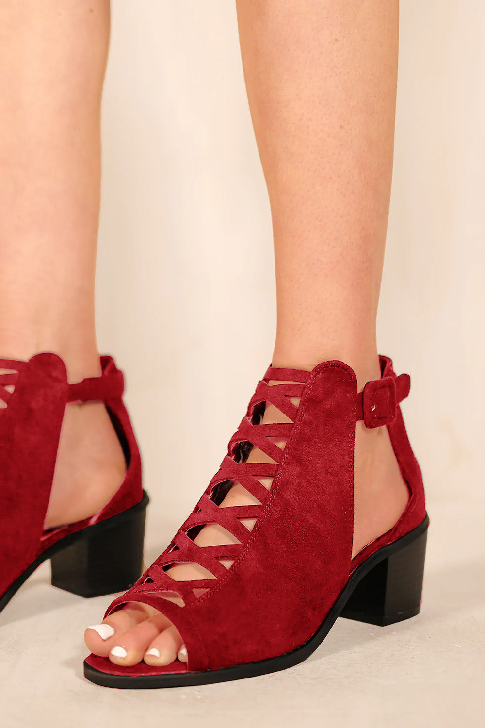 REYDAH MID HIGH BLOCK HEEL SANDALS WITH PEEP TOE & CRISS CROSS DETAIL IN ROUGE RED SUEDE