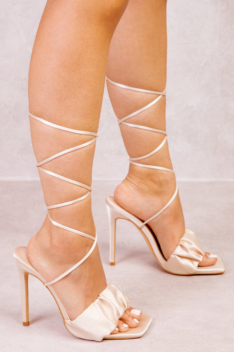 LOREZA LACE TIE UP RUCHED STRAP HEELS IN NUDE SILK